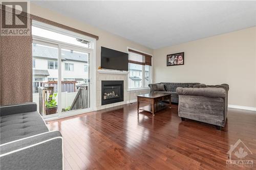 102 Popplewell Crescent, Ottawa, ON - Indoor Photo Showing Living Room With Fireplace