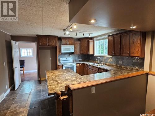 308 4Th Street W, Carlyle, SK - Indoor Photo Showing Kitchen With Double Sink