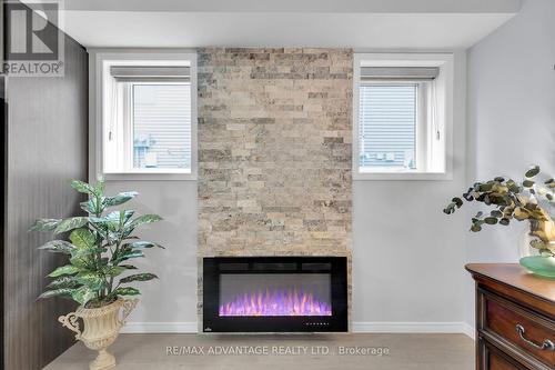 50 - 3200 Singleton Avenue, London, ON - Indoor Photo Showing Living Room With Fireplace