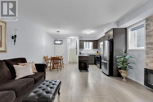 50 - 3200 Singleton Avenue, London, ON - Indoor Photo Showing Living Room With Fireplace