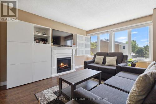 184 - 700 Osgoode Drive, London, ON - Indoor Photo Showing Living Room With Fireplace