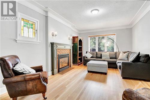 Main Floor -Living Room with Gas Fireplace - 22-24 Byron Avenue, Ottawa, ON - Indoor Photo Showing Living Room With Fireplace