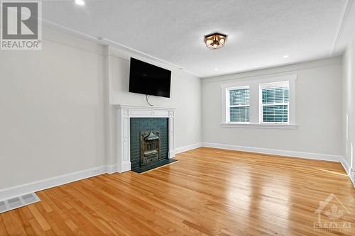 Second Floor -Living Room (electric fireplace) - 22-24 Byron Avenue, Ottawa, ON - Indoor Photo Showing Living Room With Fireplace