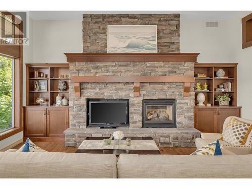 2037 Capistrano Drive, Kelowna, BC - Indoor Photo Showing Living Room With Fireplace