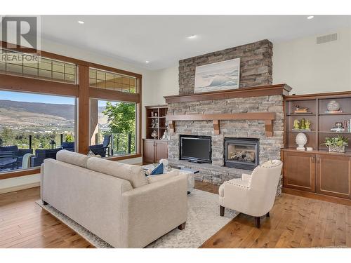 2037 Capistrano Drive, Kelowna, BC - Indoor Photo Showing Living Room With Fireplace