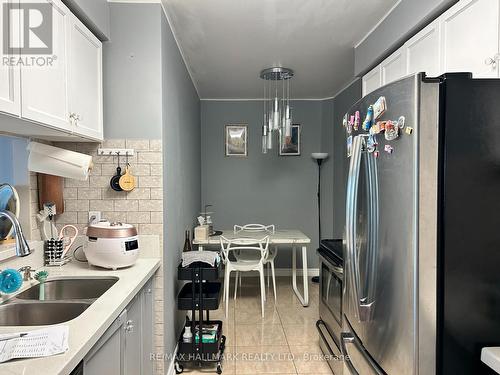 Ph206 - 1 Emerald Lane, Vaughan, ON - Indoor Photo Showing Kitchen With Double Sink