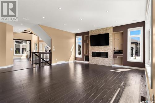 4213 Green Rose Crescent E, Regina, SK - Indoor Photo Showing Living Room With Fireplace