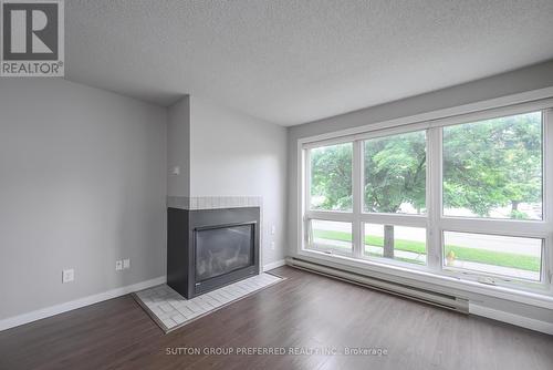 202 - 15 Jacksway Crescent, London, ON - Indoor Photo Showing Living Room With Fireplace
