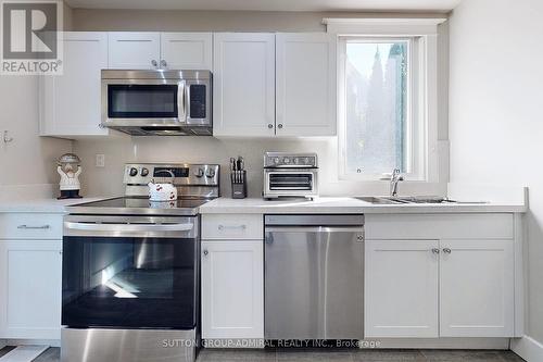3722 St. Clair Avenue E, Toronto E08, ON - Indoor Photo Showing Kitchen With Double Sink