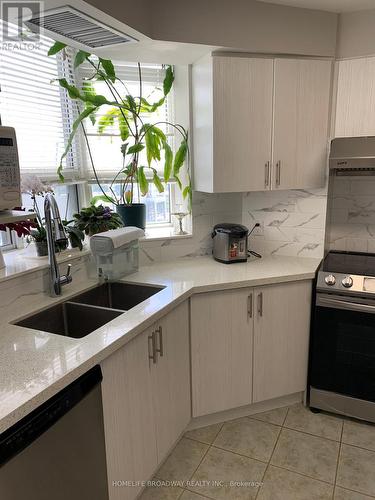 710 - 1883 Mcnicoll Avenue, Toronto (Steeles), ON - Indoor Photo Showing Kitchen With Double Sink