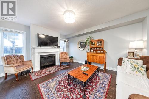 7810 Sassafras Trail, Niagara Falls, ON - Indoor Photo Showing Living Room With Fireplace