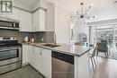 302 - 216 Oak Park Boulevard, Oakville, ON  - Indoor Photo Showing Kitchen With Stainless Steel Kitchen With Double Sink With Upgraded Kitchen 