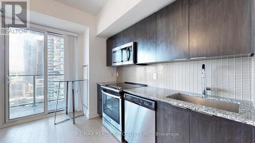 1513 - 30 Shore Breeze Drive, Toronto (Mimico), ON - Indoor Photo Showing Kitchen With Upgraded Kitchen