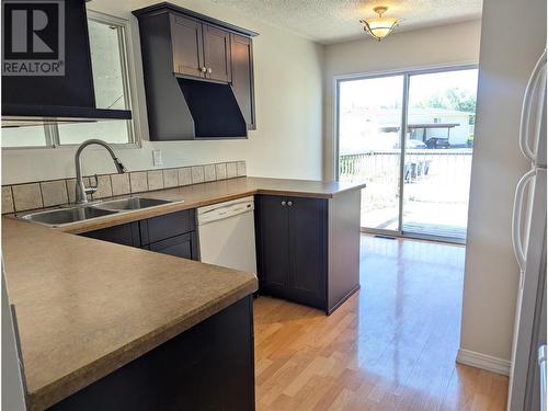 1087 Monterey Court, Kelowna, BC - Indoor Photo Showing Kitchen With Double Sink