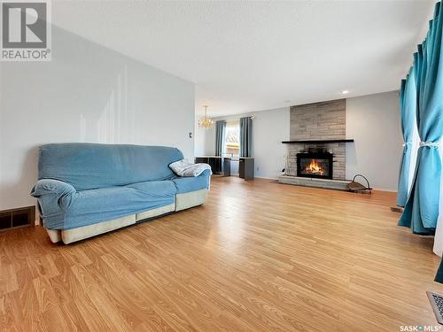 318 Orton Street, Cut Knife, SK - Indoor Photo Showing Living Room With Fireplace