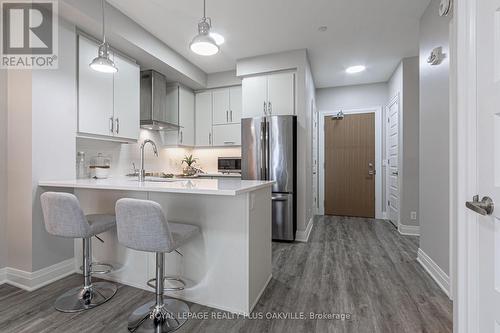 428 - 128 Grovewood Common, Oakville, ON - Indoor Photo Showing Kitchen With Stainless Steel Kitchen With Upgraded Kitchen