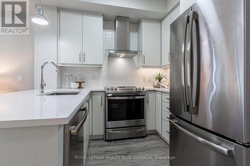 428 - 128 Grovewood Common, Oakville, ON - Indoor Photo Showing Kitchen With Stainless Steel Kitchen With Upgraded Kitchen