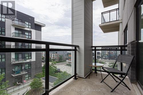 428 - 128 Grovewood Common, Oakville, ON - Outdoor With Balcony With Exterior