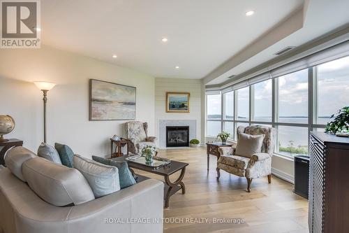 1011 - 2 Toronto Street S, Barrie (City Centre), ON - Indoor Photo Showing Living Room With Fireplace