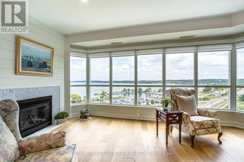 1011 - 2 Toronto Street S, Barrie (City Centre), ON - Indoor Photo Showing Living Room With Fireplace