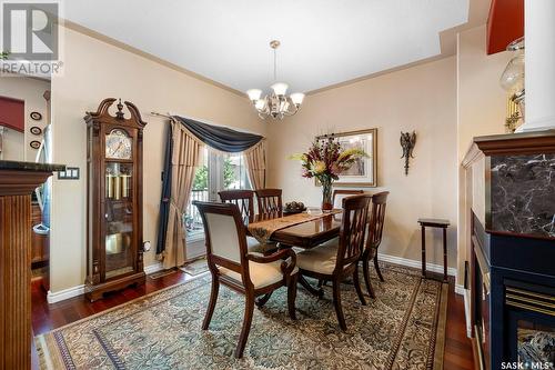 12030 Wascana Heights, Regina, SK - Indoor Photo Showing Dining Room With Fireplace