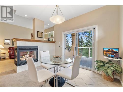 4520 Gallaghers Lookout Unit# 6, Kelowna, BC - Indoor Photo Showing Dining Room With Fireplace