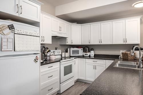 12870 Cliffshore Drive, Lake Country, BC - Indoor Photo Showing Kitchen With Double Sink