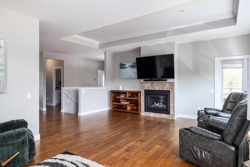 12870 Cliffshore Drive, Lake Country, BC - Indoor Photo Showing Living Room With Fireplace