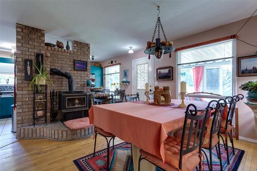 1845 Cardinal Creek Road, Kelowna, BC - Indoor Photo Showing Dining Room With Fireplace