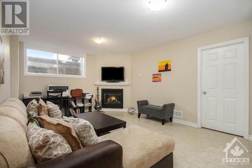 129 Mancini Way, Ottawa, ON - Indoor Photo Showing Other Room With Fireplace