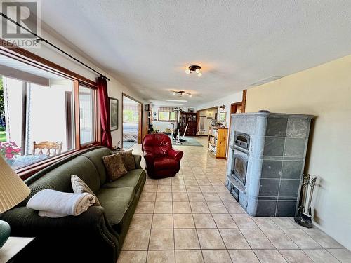 5790 Timothy Lake Road, Lac La Hache, BC - Indoor Photo Showing Living Room With Fireplace