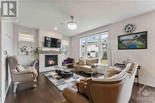 62 Viceroy Mews, Ottawa, ON - Indoor Photo Showing Living Room With Fireplace