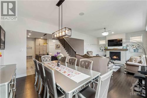 62 Viceroy Mews, Ottawa, ON - Indoor Photo Showing Dining Room With Fireplace