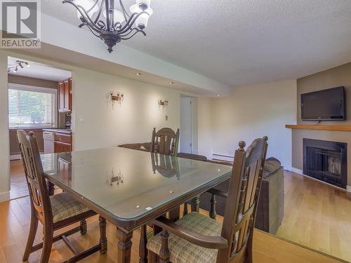 310 Yorkton Avenue Unit# 1, Penticton, BC - Indoor Photo Showing Dining Room With Fireplace