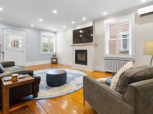 Salon - 48 Av. Hillcrest, Montréal (Lachine), QC - Indoor Photo Showing Living Room With Fireplace