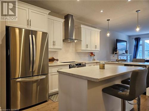 Friends and family will gather around the central island and the peninsula - 360 Mary Rose Avenue, Port Elgin, ON - Indoor Photo Showing Kitchen With Upgraded Kitchen