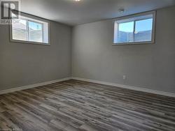 Bedroom 3 in the basement with large, lighted closet and two big windows - 