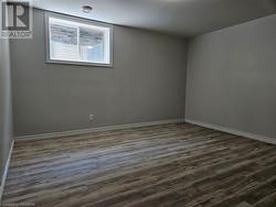 Bedroom 4 in the basement with large window and lighted closet - 