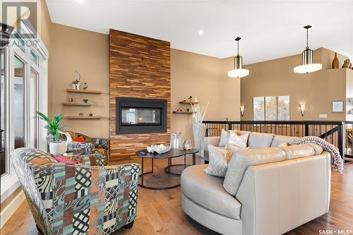 23 Emerald Creek Road, White City, SK - Indoor Photo Showing Living Room With Fireplace