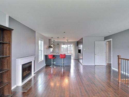 Overall view - 155 Rue Chabot, Val-D'Or, QC - Indoor Photo Showing Living Room With Fireplace