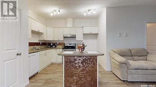 185 Chateau Crescent, Pilot Butte, SK - Indoor Photo Showing Kitchen With Double Sink