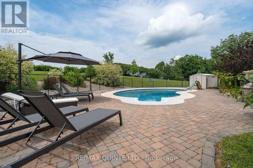 107 Country Charm Drive, Belleville, ON - Outdoor With In Ground Pool