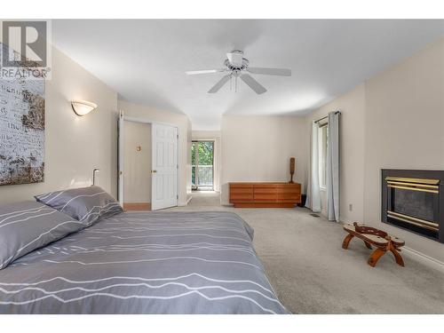 3761 Mcculloch Road, Kelowna, BC - Indoor Photo Showing Bedroom With Fireplace