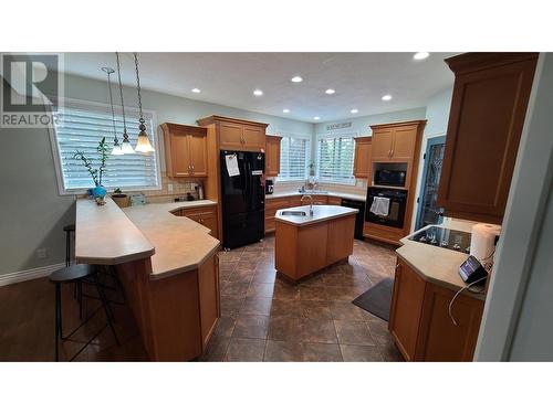 1092 Rockcliffe Road, Oliver, BC - Indoor Photo Showing Kitchen With Fireplace