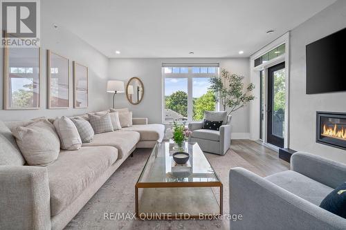 507 - 17 Cleave Avenue, Prince Edward County (Picton), ON - Indoor Photo Showing Living Room With Fireplace