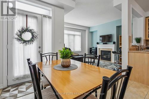 11 Abraham Welsh Road, Toronto, ON - Indoor Photo Showing Dining Room With Fireplace