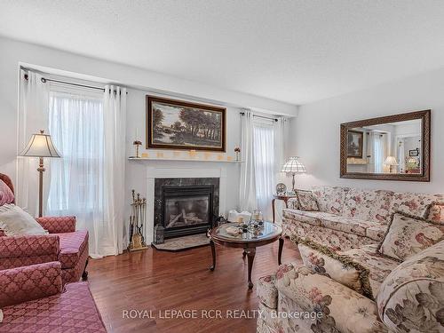 33 Prince Of Wales Dr, Barrie, ON - Indoor Photo Showing Living Room With Fireplace