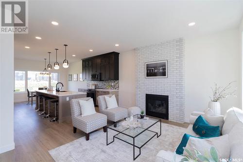 1023 Glacial Shores Common, Saskatoon, SK - Indoor Photo Showing Living Room With Fireplace