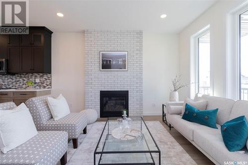 1023 Glacial Shores Common, Saskatoon, SK - Indoor Photo Showing Living Room With Fireplace