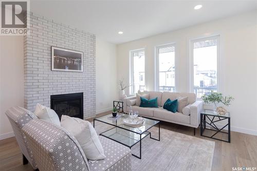 1023 Glacial Shores Common, Saskatoon, SK - Indoor Photo Showing Living Room With Fireplace